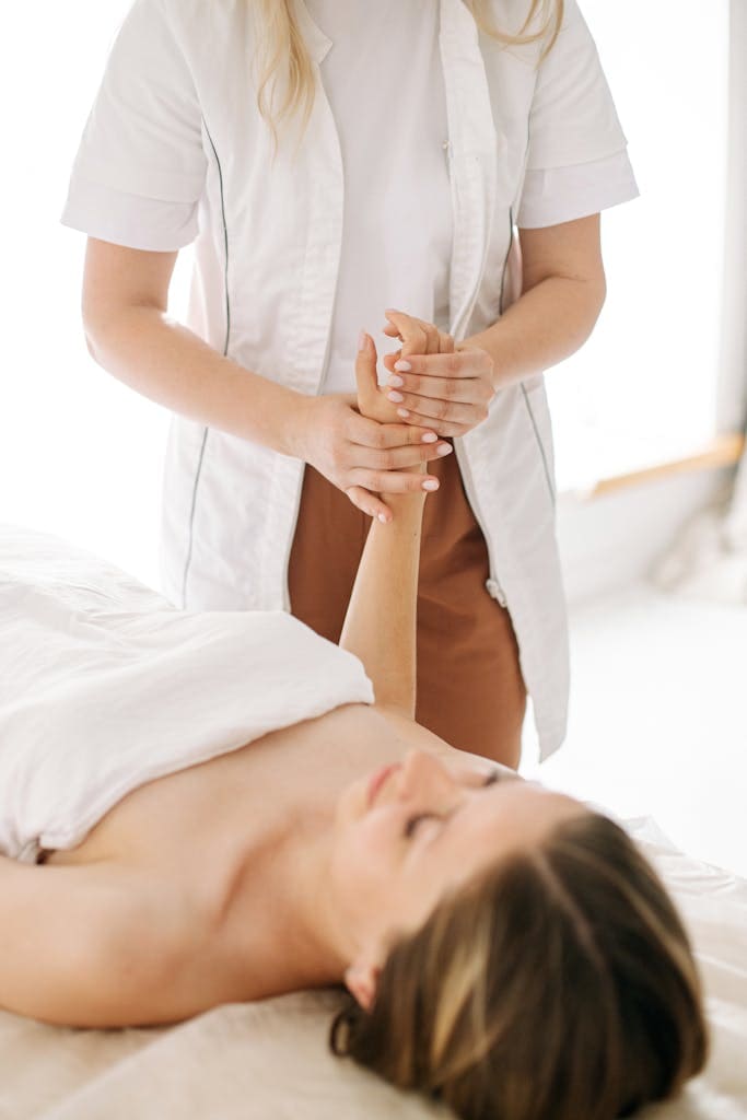 Massage therapist practicing self-care for career longevity